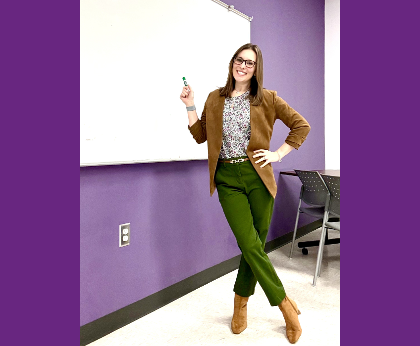 Teacher pointing at a whiteboard